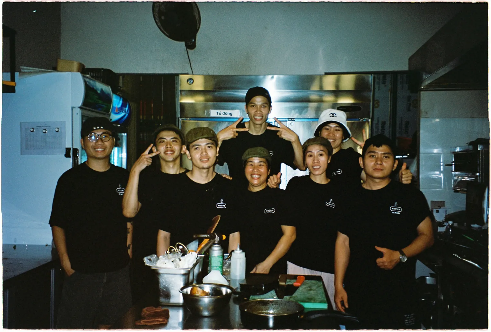 The Missteak kitchen team together at the pass, photographed on film